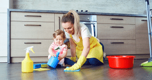 baby girl cleaning with mom