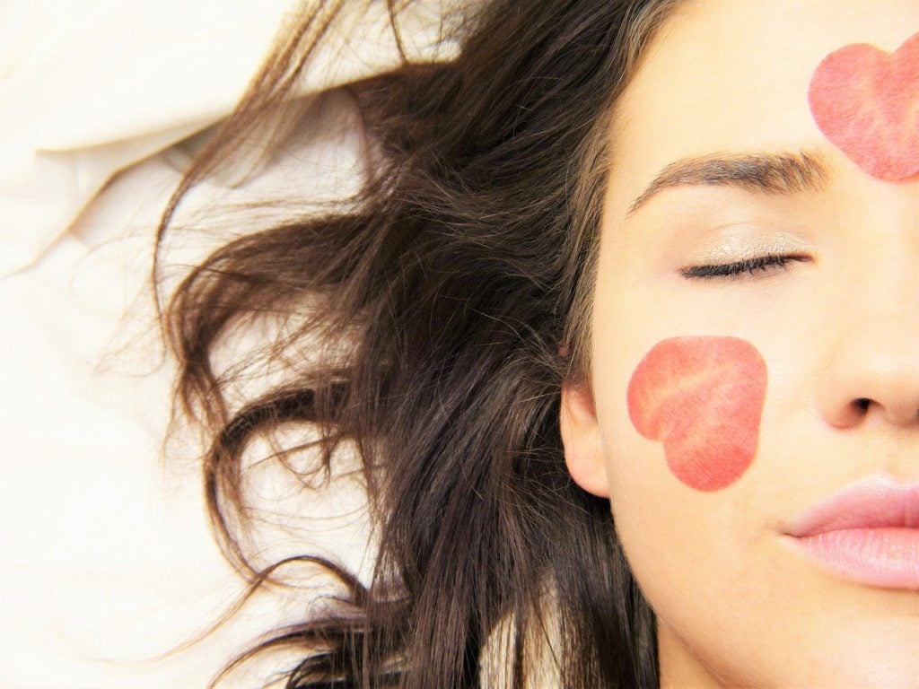 woman's face with flower petals