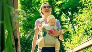 mother baby wearing with a baby carrier